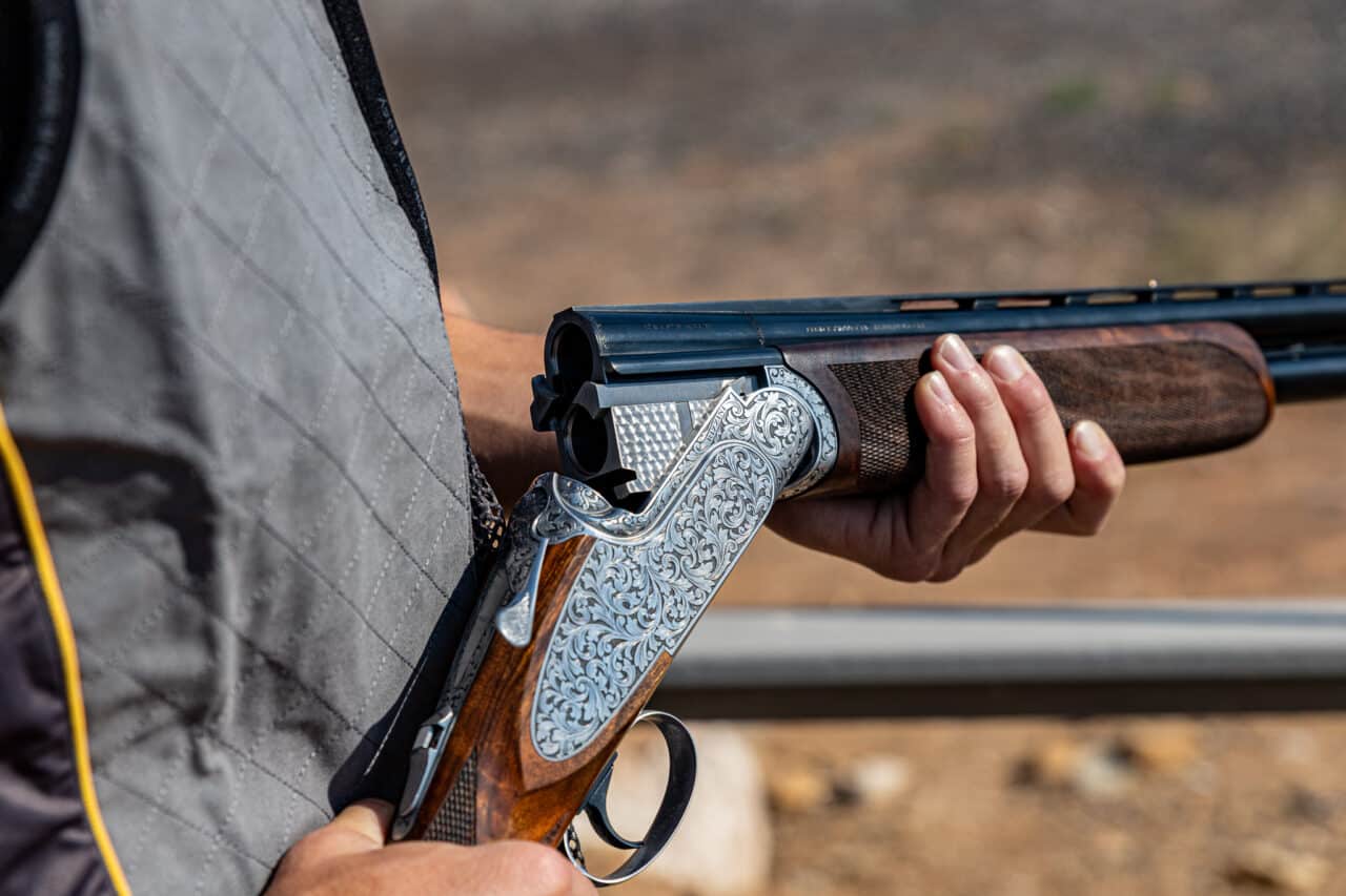 man-holding-rizzini-shotgun-with-action-open